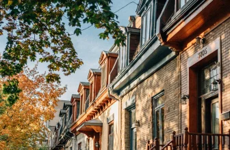 Colourful row houses on a tree-lined street in Montreal in autumn