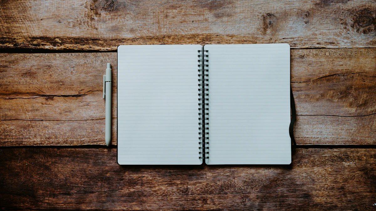 A blank spiral notebook with a pen on a wooden table